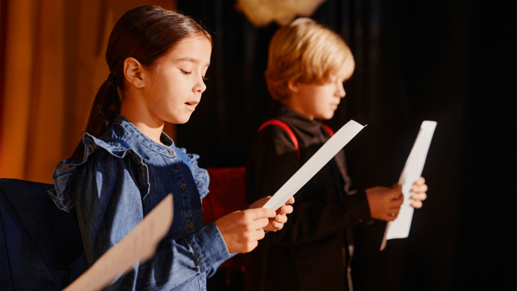 Kids singing at a camp held by a Theater Company.